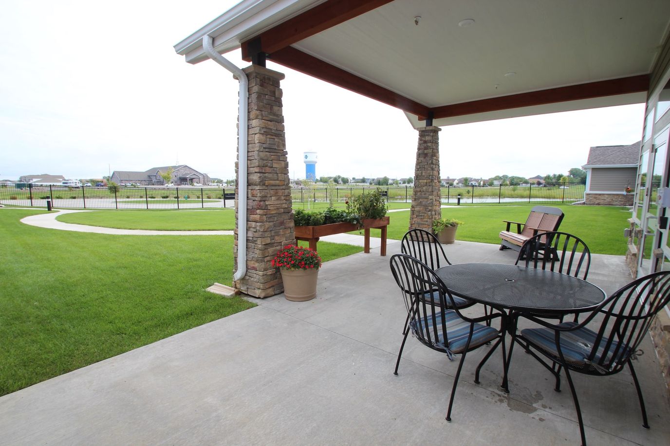 Outdoor sitting area with a view of the landscaped grounds