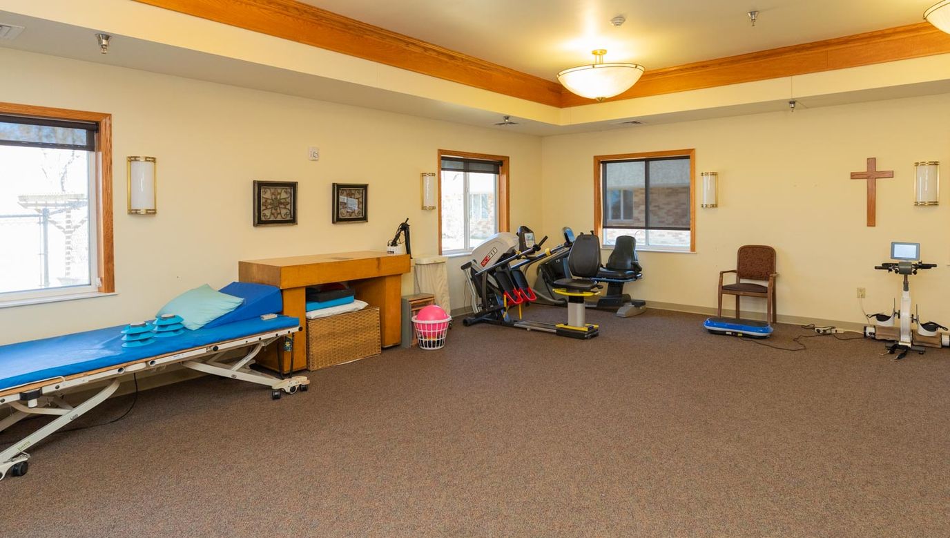 Rehabilitation equipment in a well-lit activity room