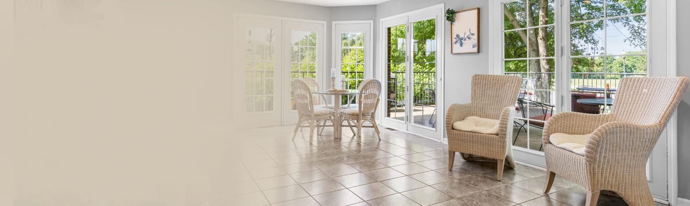 Bright common area with cozy seating and outdoor view