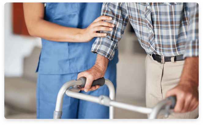 Staff assisting a resident with a walker