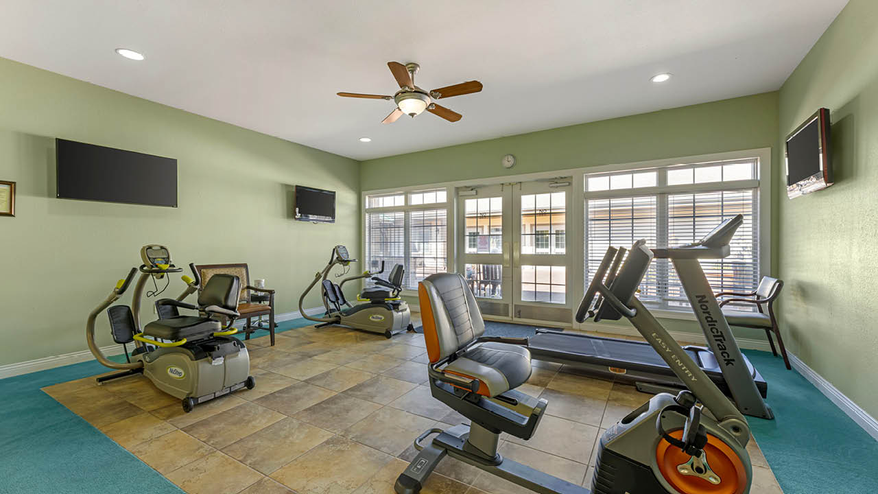 Well-equipped fitness room with exercise machines
