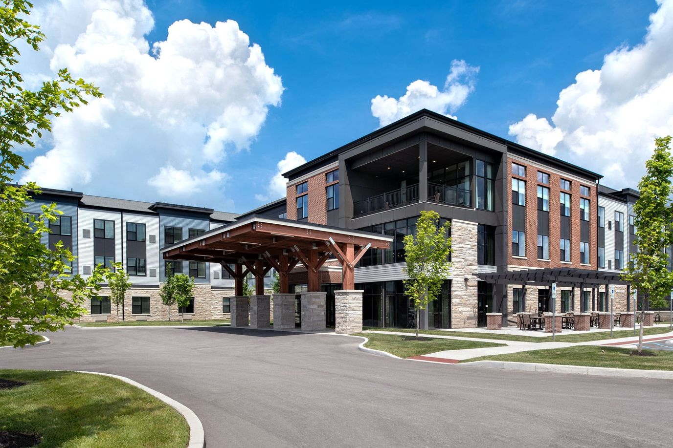 Exterior view of the Charter Senior Living facility with landscaped entry