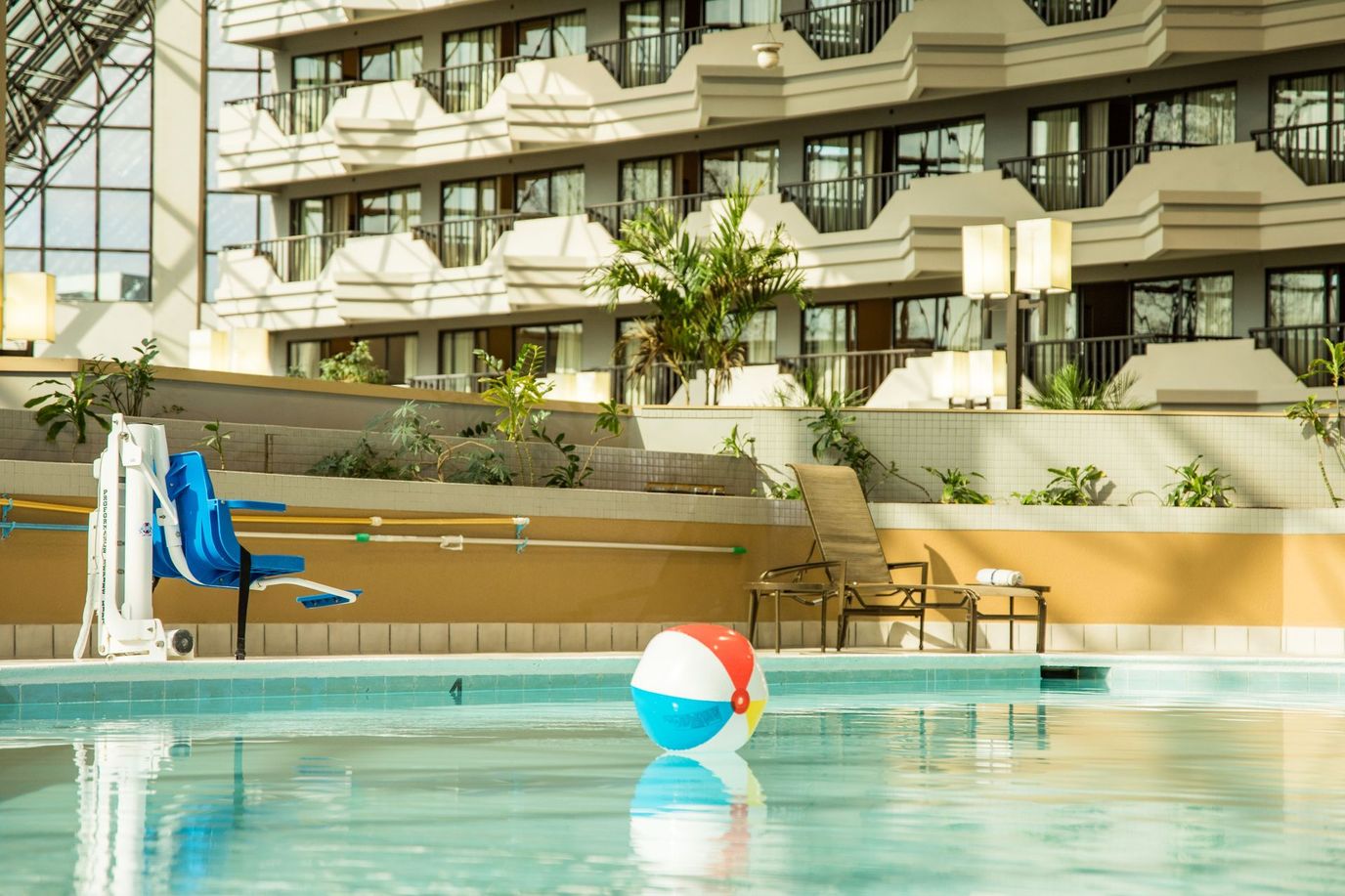 Indoor pool area with a beach ball