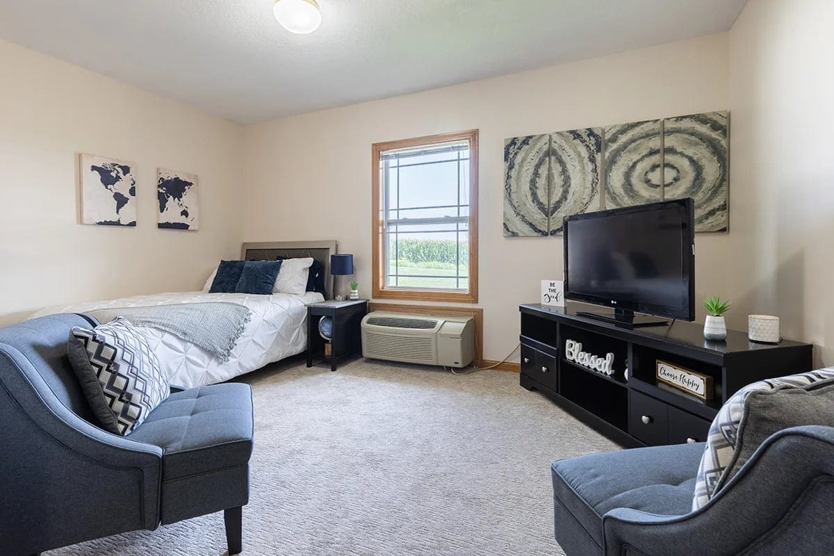 A cozy private resident room with furnishings