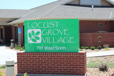 Locust Grove Village, Nursing Home in La Crosse, KS — Sign for Locust Grove Village senior living facility