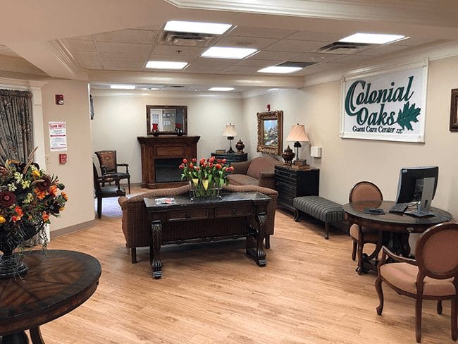 Interior view of Colonial Oaks common area with seating