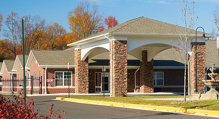 Exterior view of an assisted living facility with a welcoming entrance