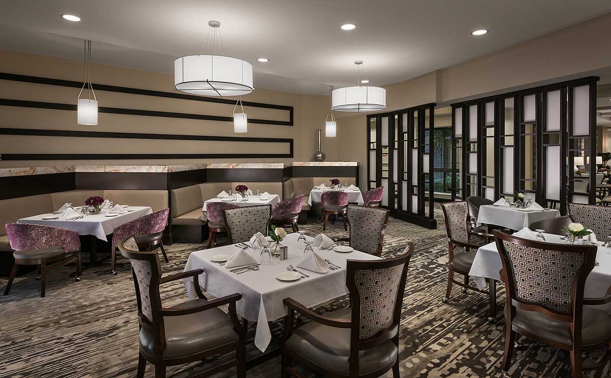 Elegant dining room with set tables and chairs