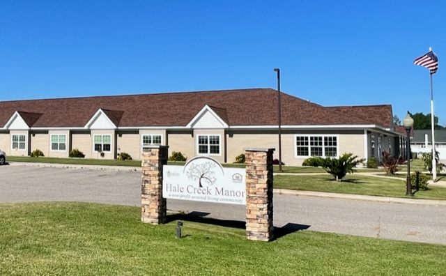 Exterior view of Hale Creek Manor facility with signage