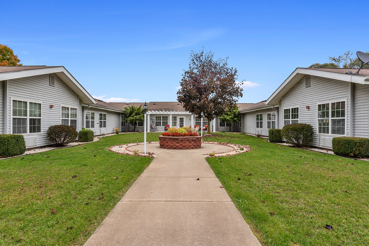 Exterior view of LakeHouse Three Rivers with garden and pathway