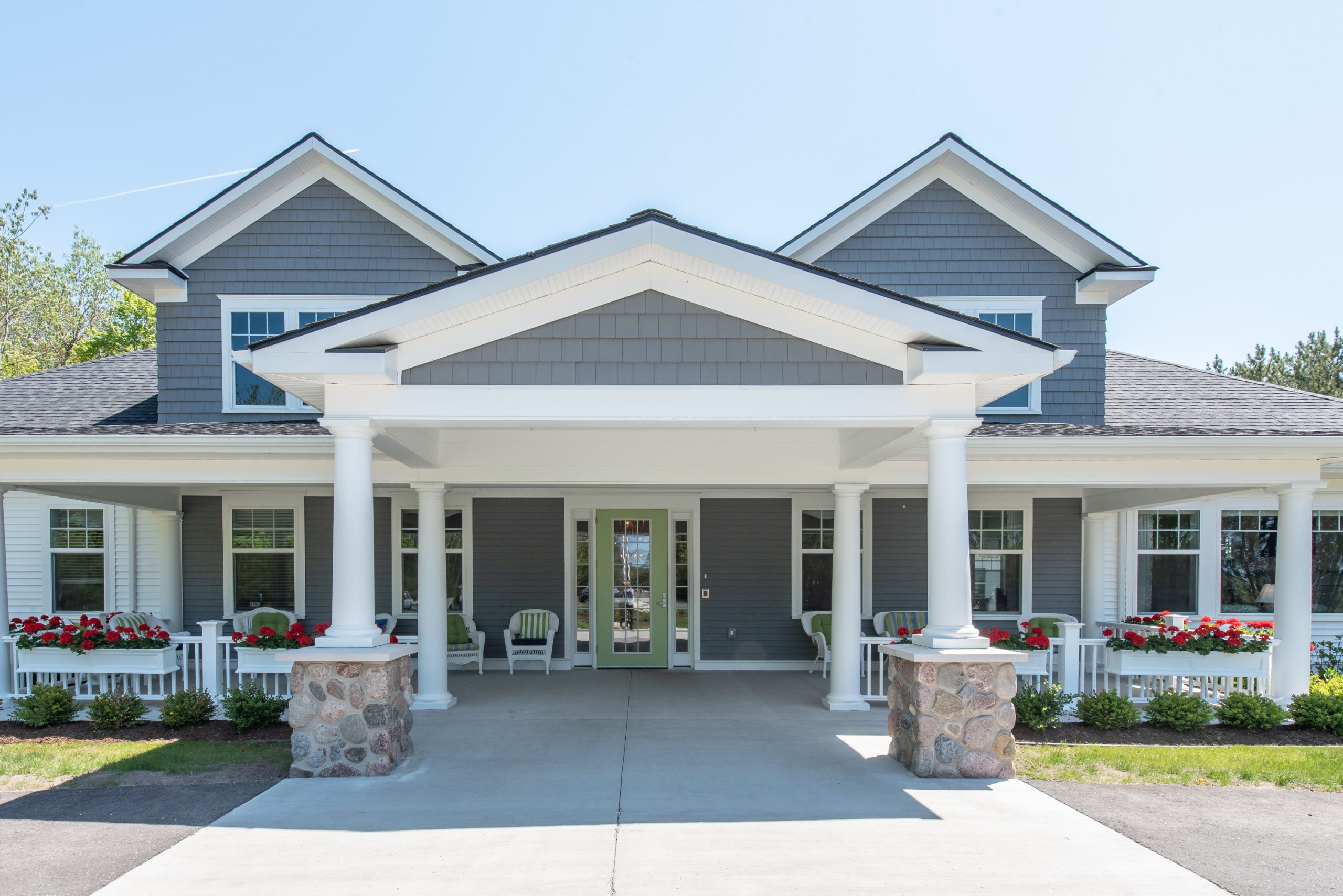 Exterior view of Pineview Cottage with flowerbeds