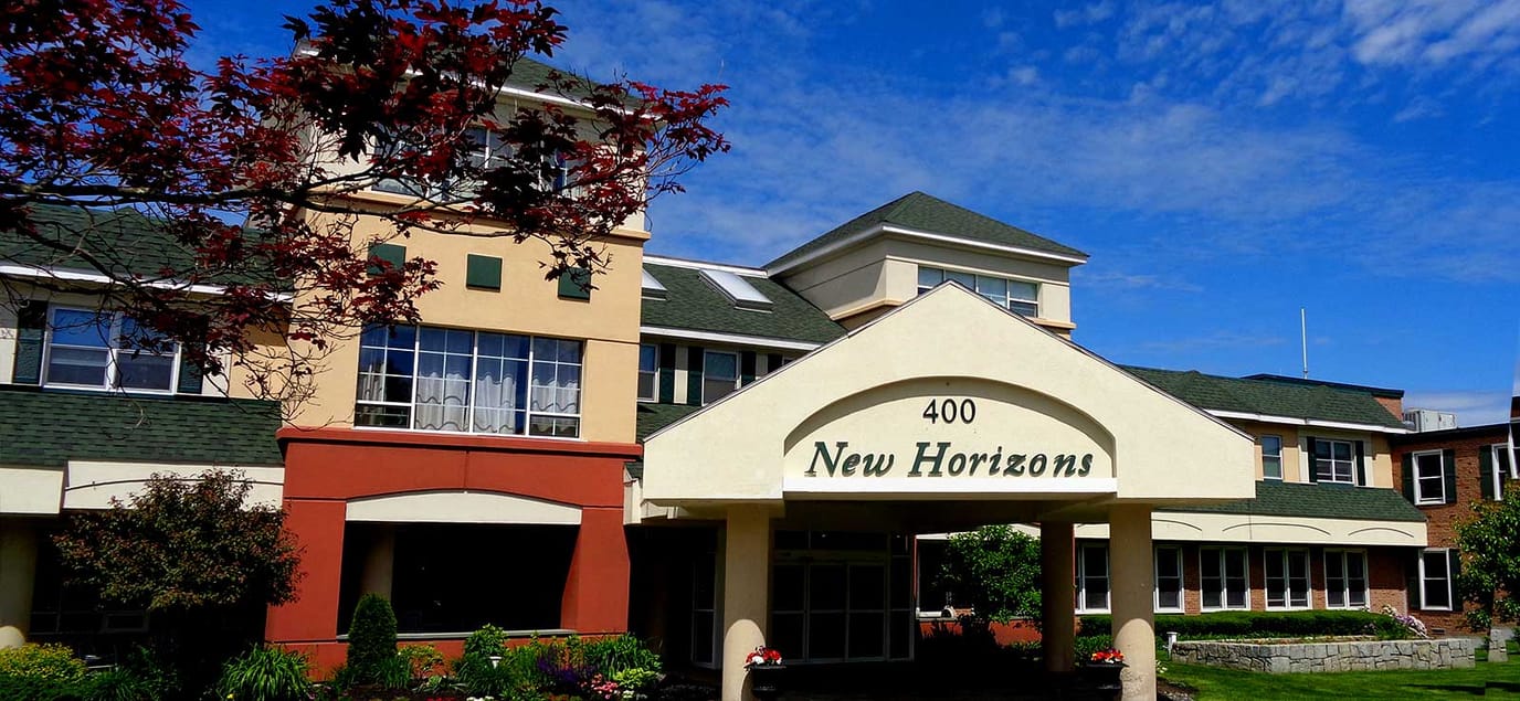 Exterior view of New Horizons facility with signage