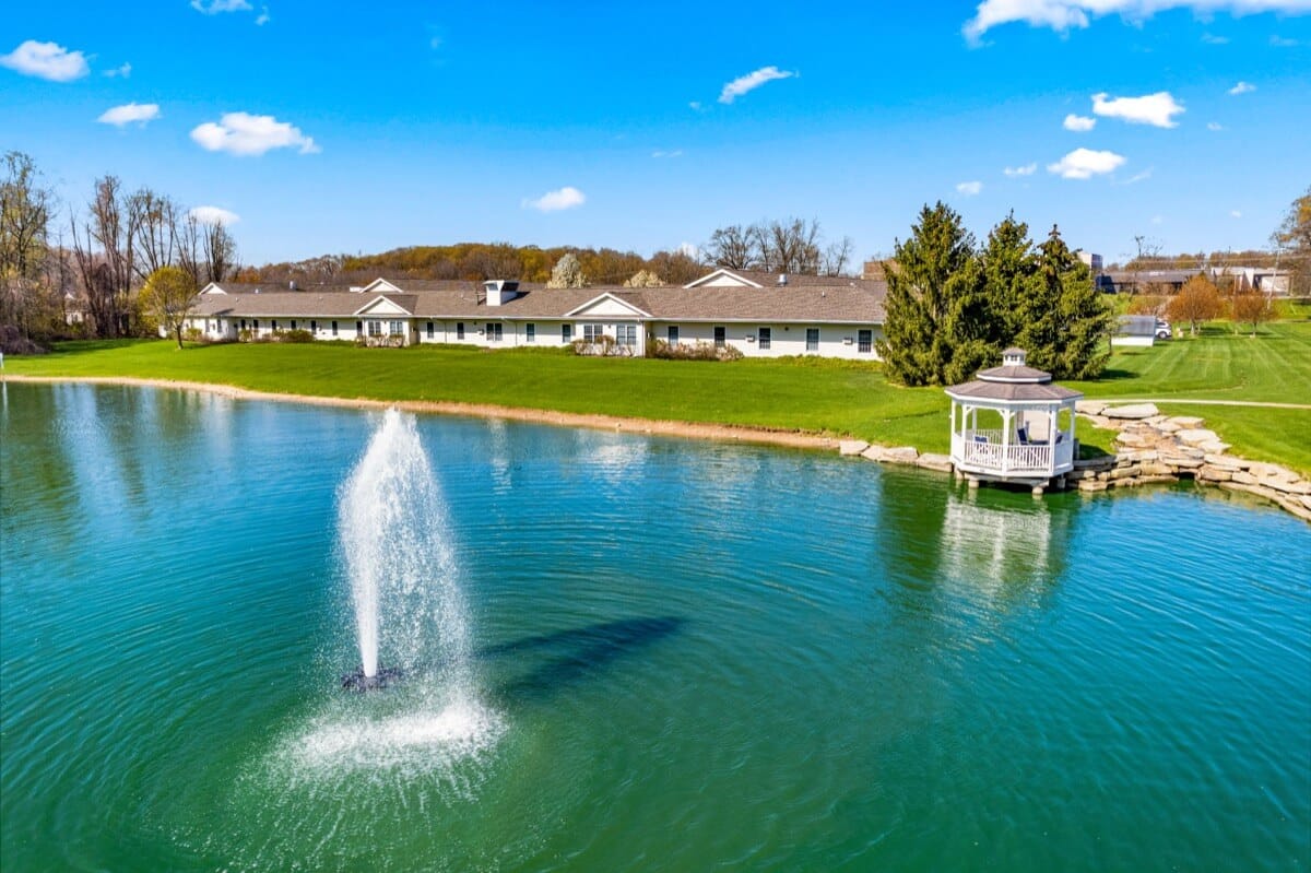 Aerial view of the assisted living facility by the pond