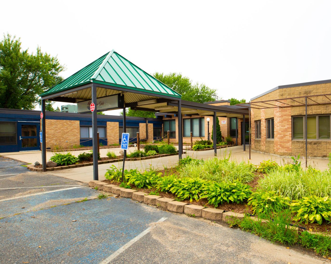 Exterior view of a senior living facility with landscaping