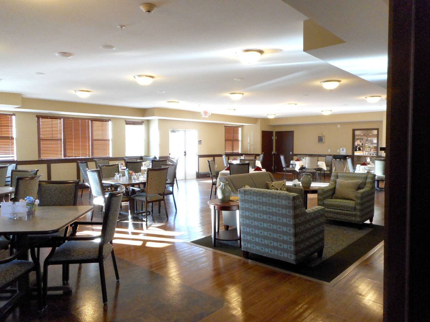 Bright common area with seating and tables