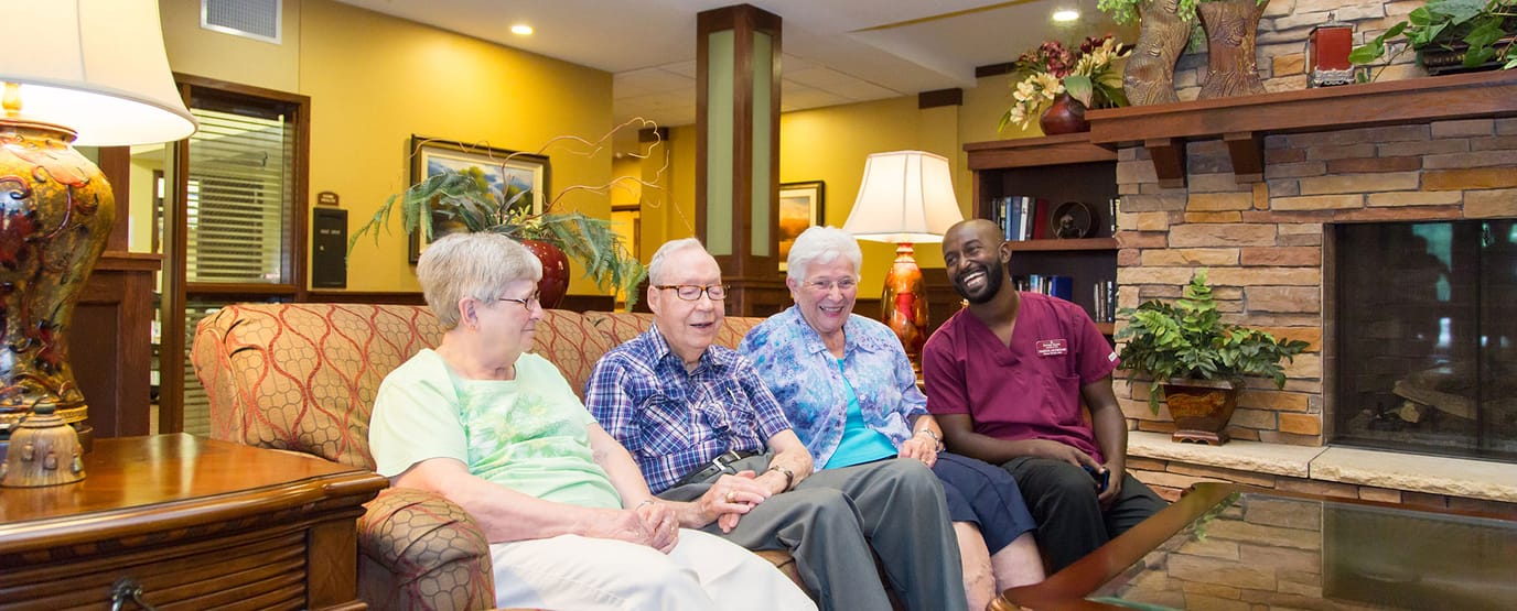 Residents and staff enjoying time together in a common area