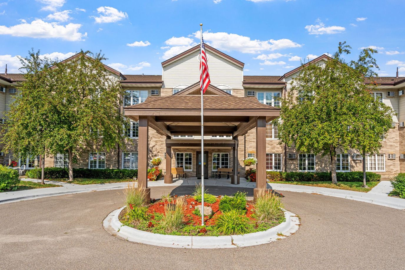 Exterior view of the assisted living facility with landscaping