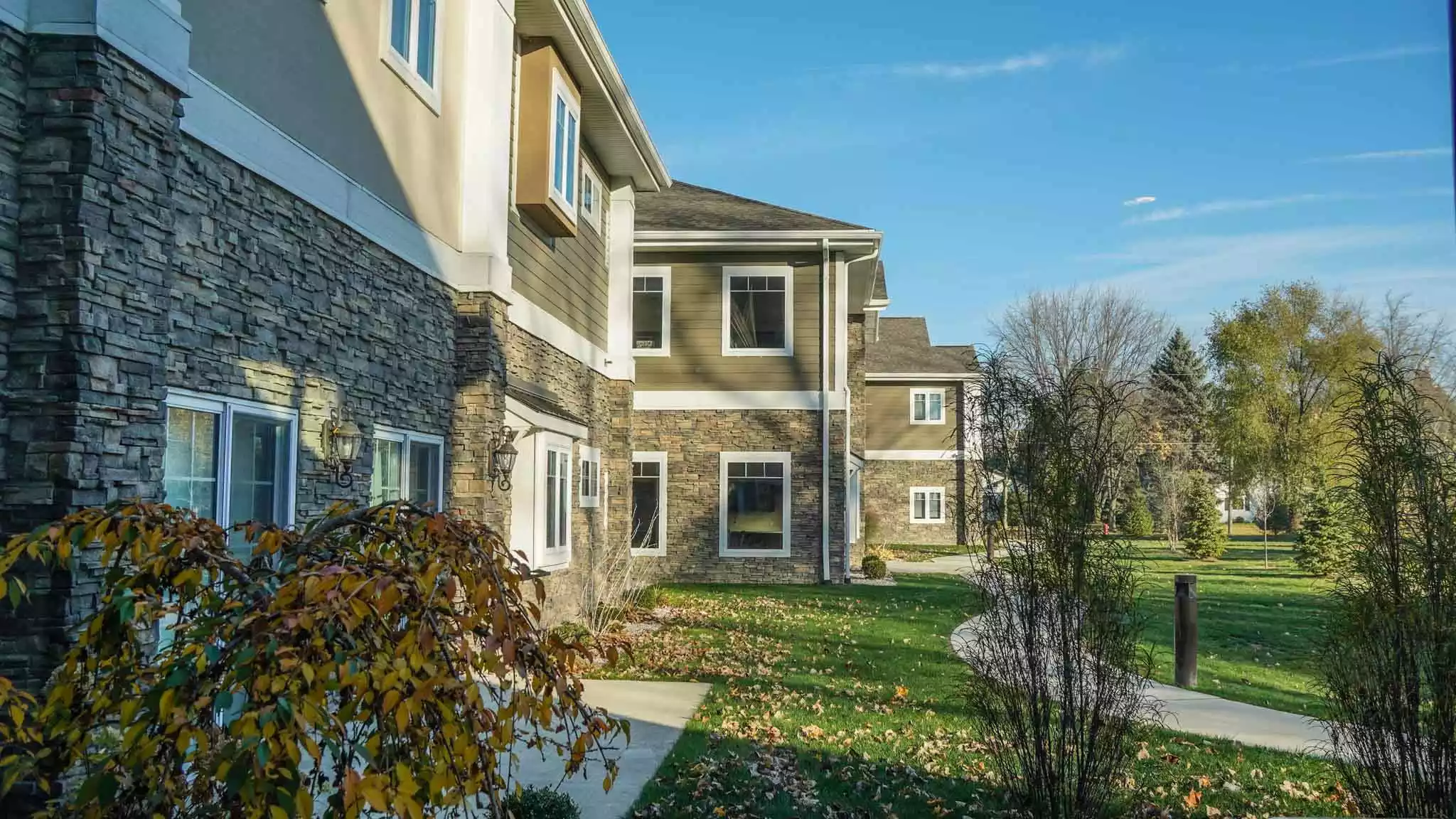 Exterior view of the assisted living facility with landscaping