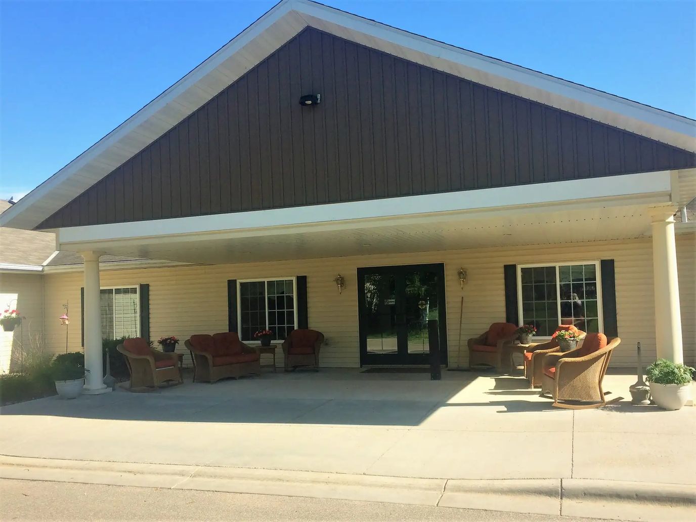 Entrance of Northern Pines Assisted Living with seating