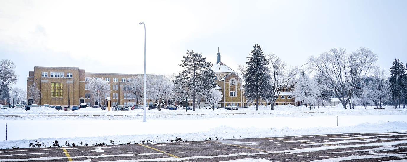 Snow-covered outdoor view of a senior living facility.