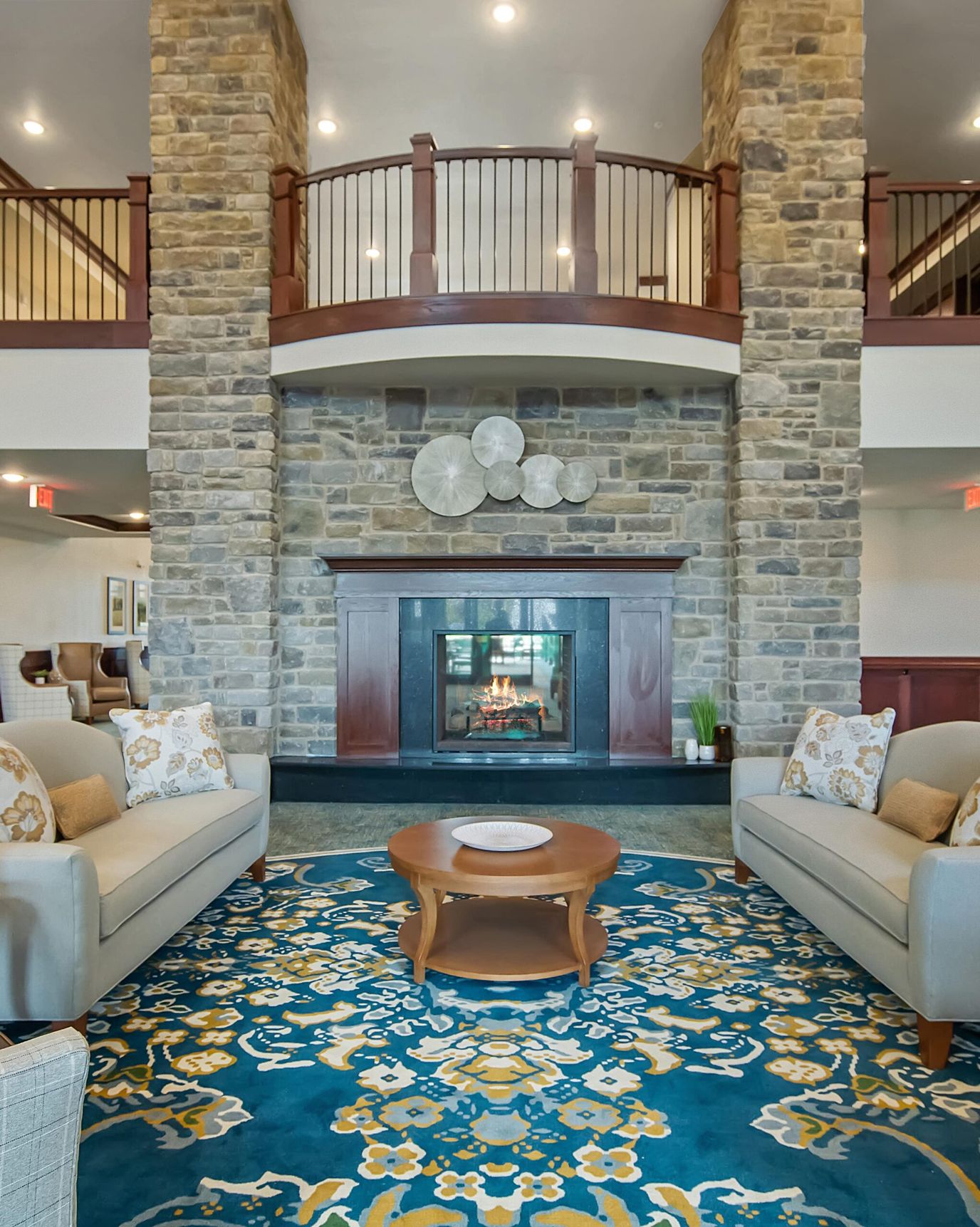 Cozy lobby area with a fireplace and seating