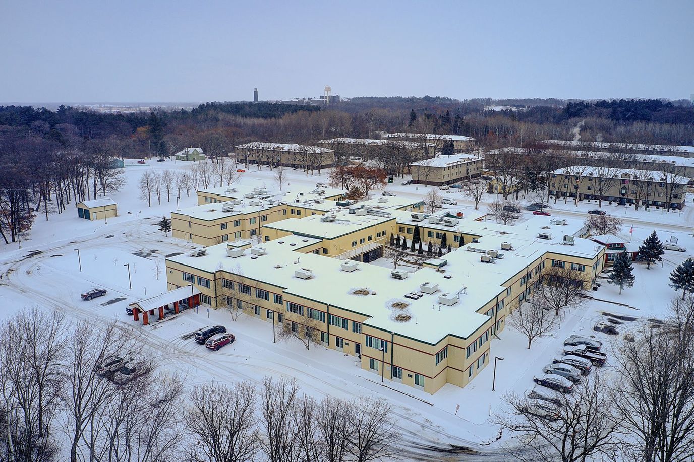 Aerial view of a snow-covered assisted living facility