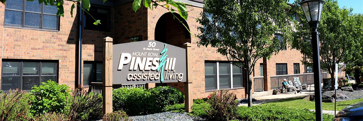 Exterior sign of Pines III Assisted Living facility.