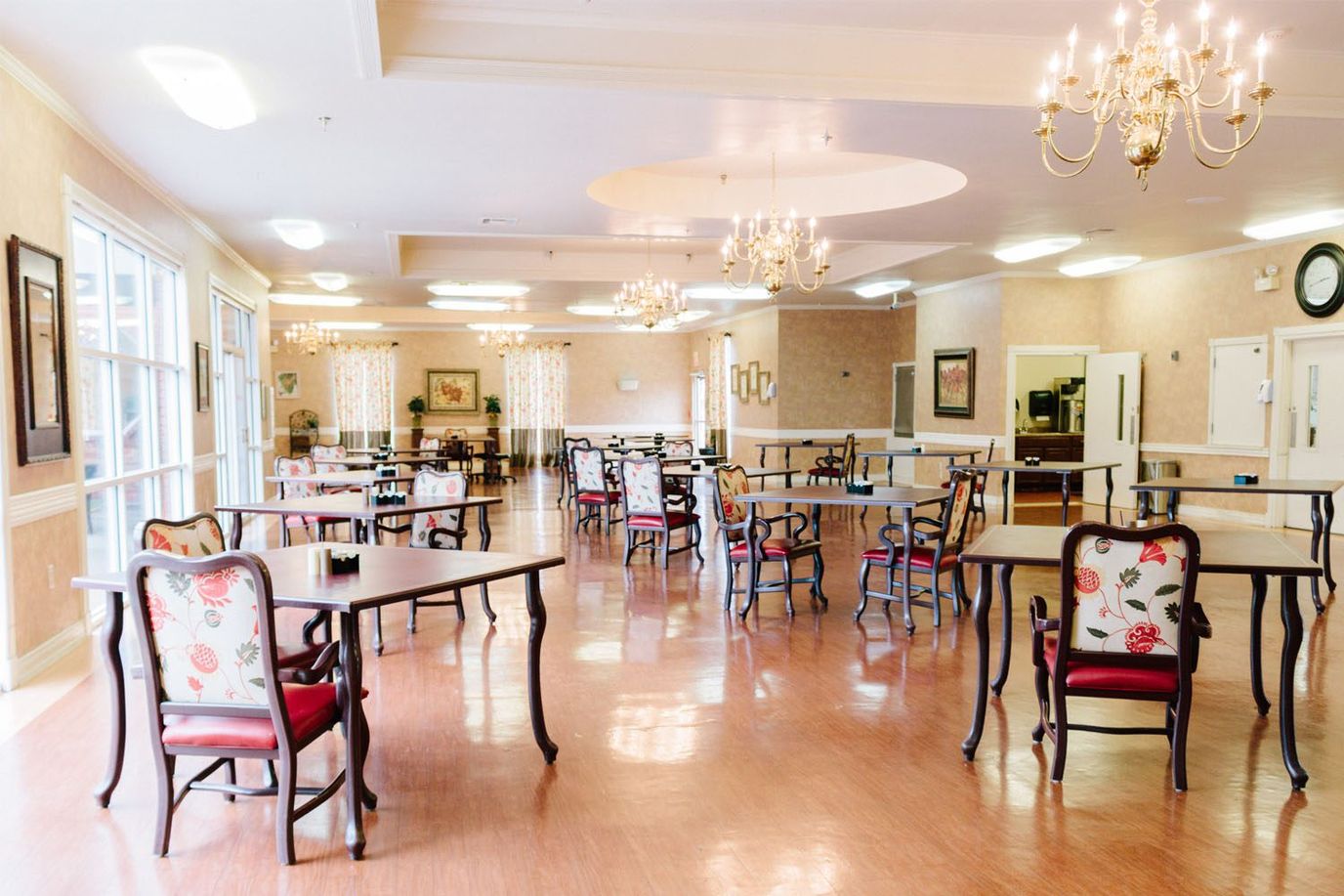 Dining area with tables and chairs in a spacious room
