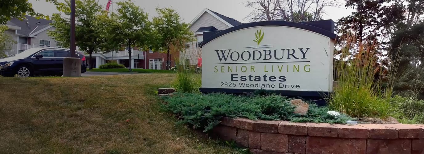Woodbury Senior Living Estates sign in a landscaped area