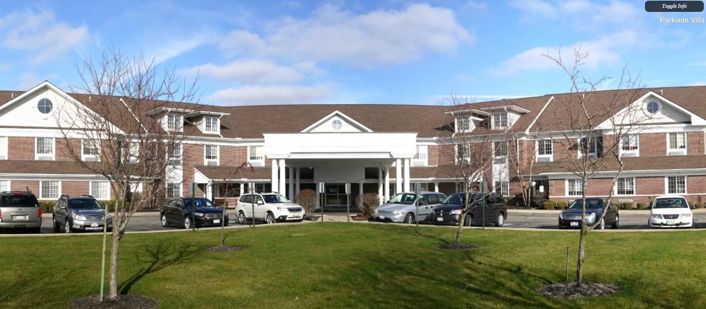 Exterior view of Parkside Villa with gardens and parking