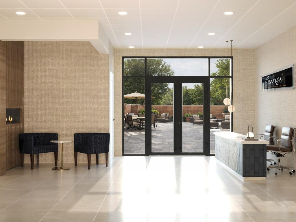 A bright lobby area with seating and outdoor access