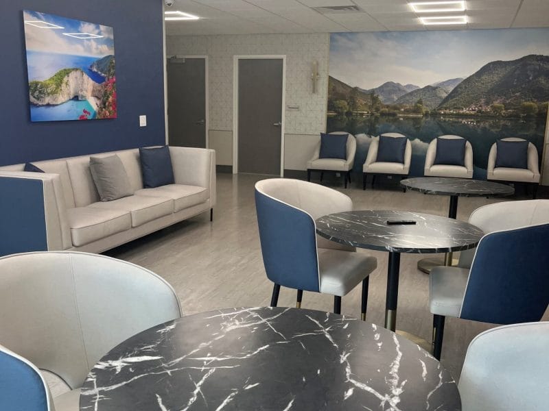 Bright common area with seating and artwork