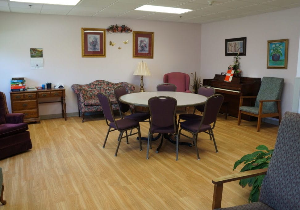 Common area in a nursing home with seating and decor