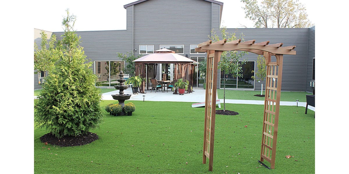 Outdoor space with gazebo and greenery