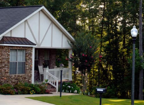 Exterior view of a cottage-style residence in a garden