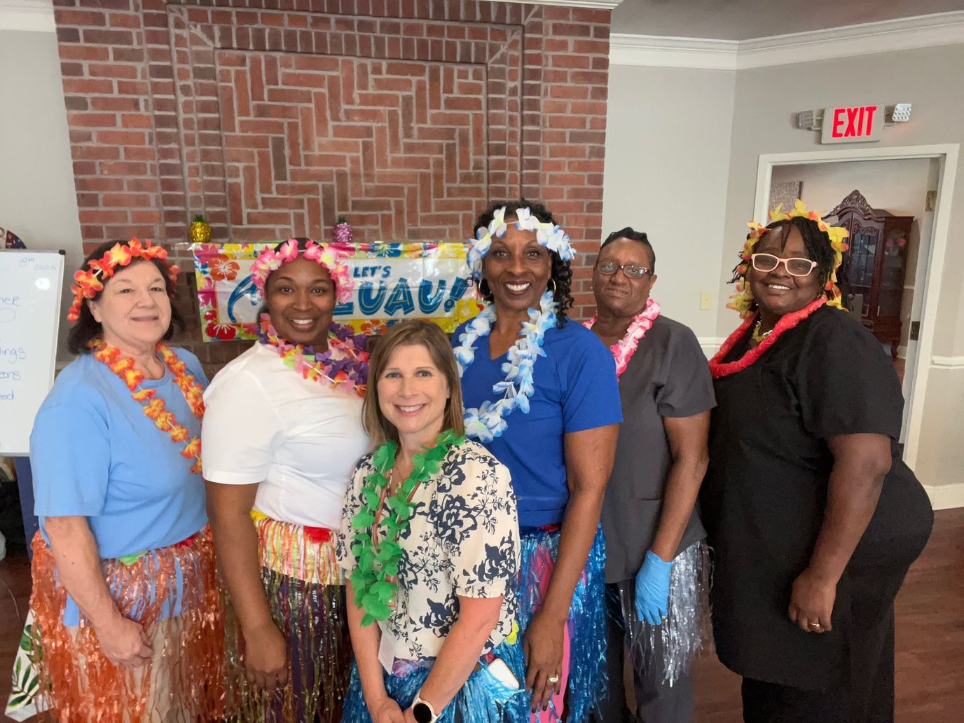 Staff members in bright attire for a themed event