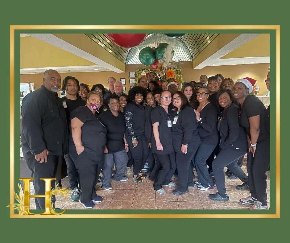 Staff posing together in a common area