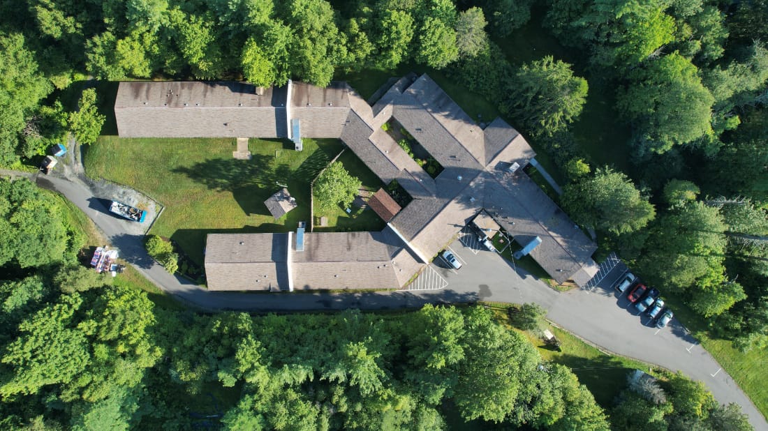 Aerial view of the assisted living facility surrounded by trees