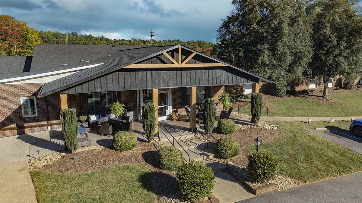 Front exterior of Brockford Inn with landscaped garden