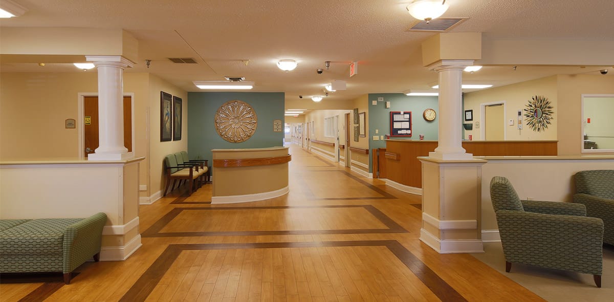 Interior view of a nursing home common area with seating