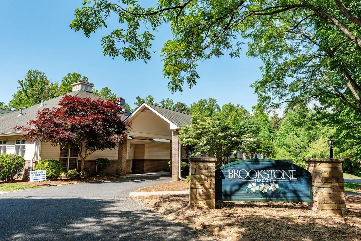 Exterior view of Brookstone facility with landscaping.