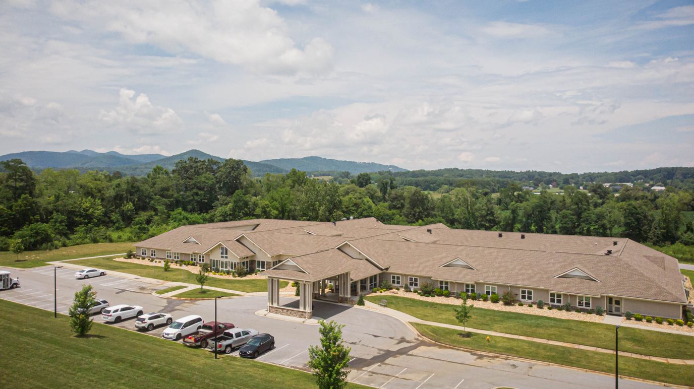 Aerial view of an assisted living facility with gardens