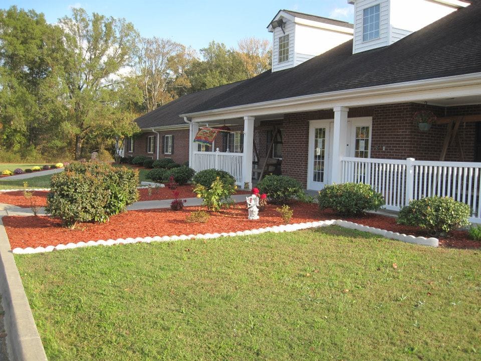 Exterior view of the facility with landscaped garden