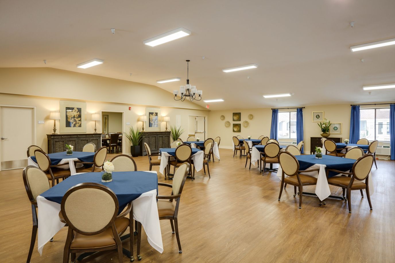 Bright dining room with tables and chairs arranged
