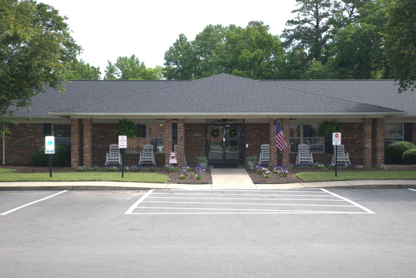 Exterior view of Waterbrooke facility with landscaped entrance