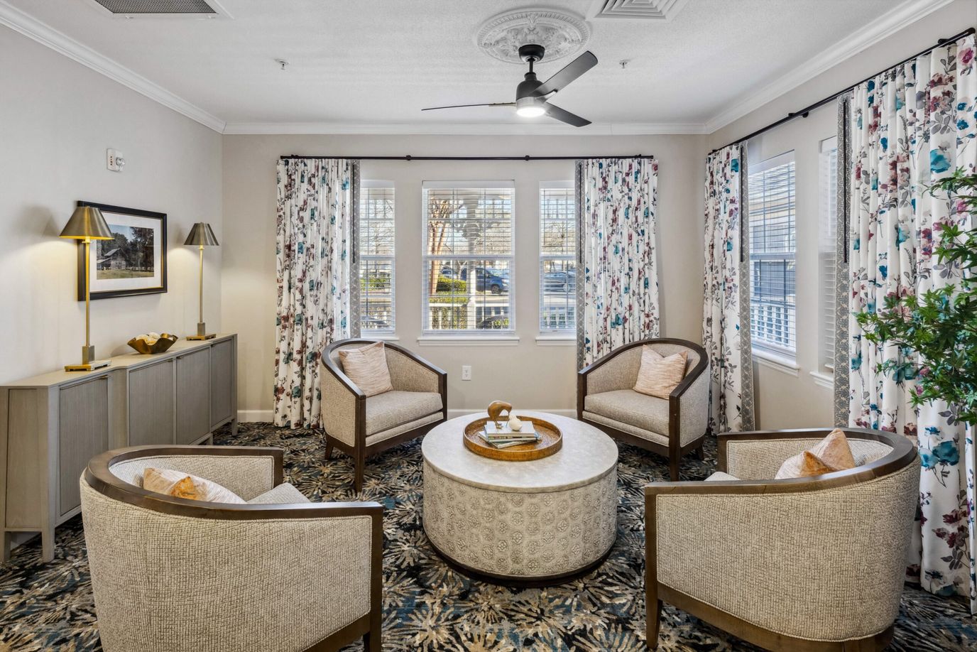 Bright common area with seating and decorative curtains