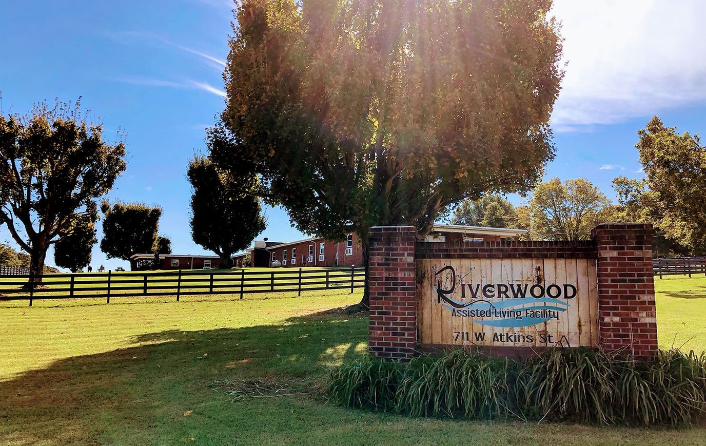 Exterior view of Riverwood Assisted Living Facility sign