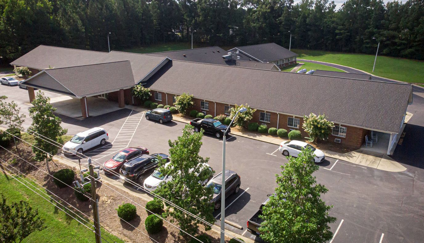 Aerial view of Dunmore Senior Living building and parking lot