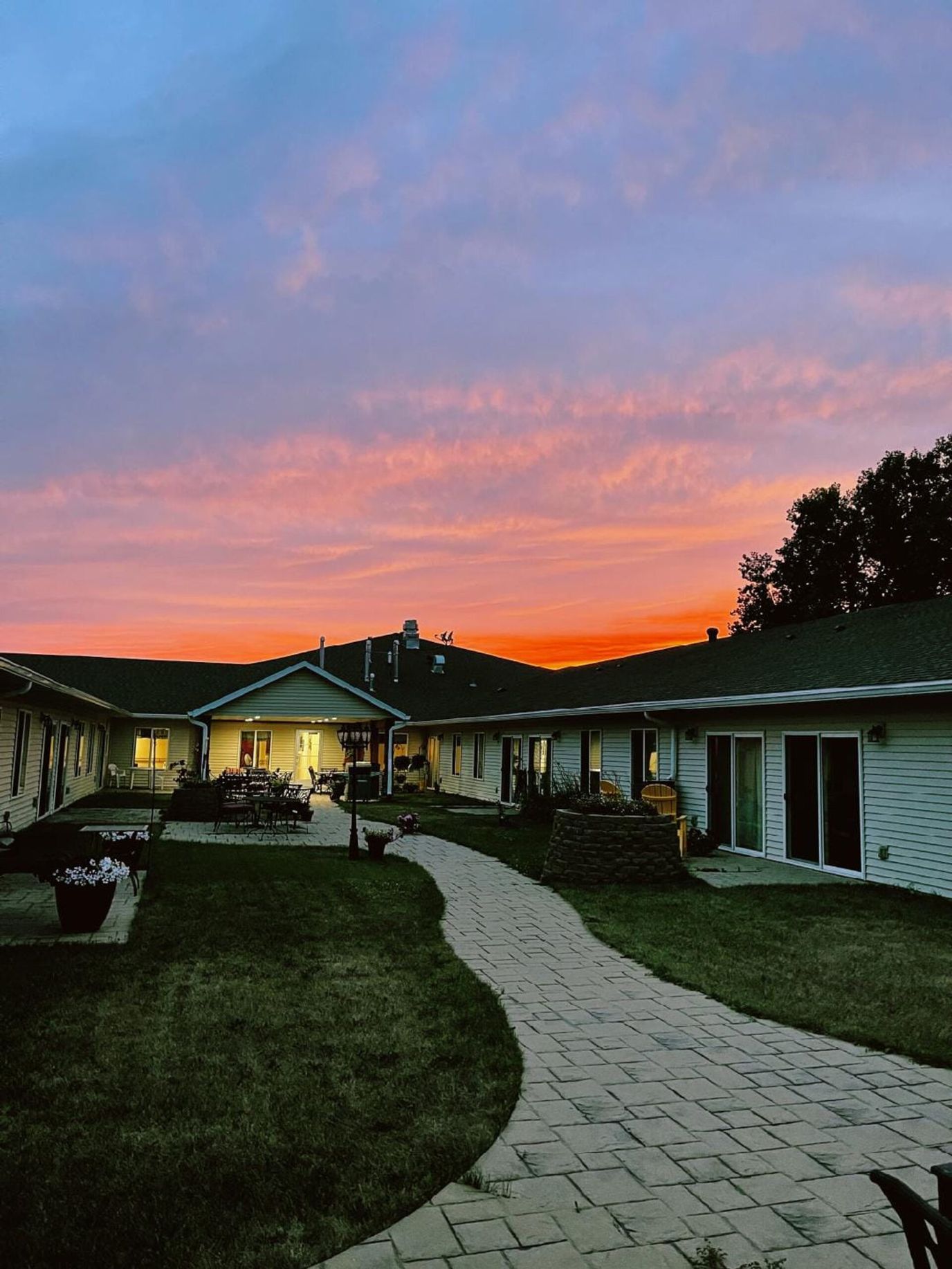 Pathway leading to a building at sunset