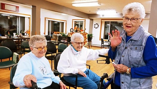 Bridgeview Estates, Inc., assisted living in Valley City, ND — Seniors socializing in a cozy communal area